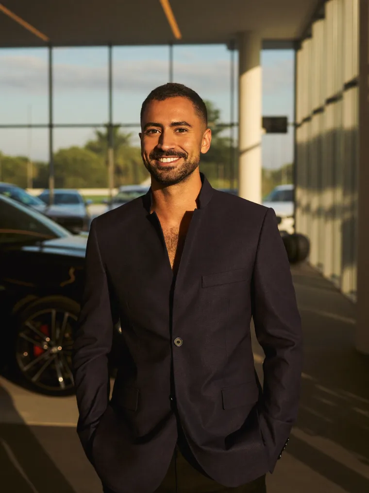 OneClickDrive senior auto-finance advisor in a Dubai showroom